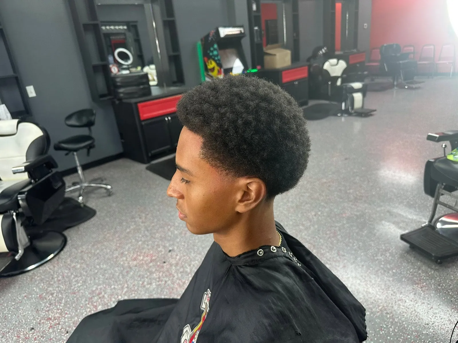 Natural afro top with a clean taper and line-up