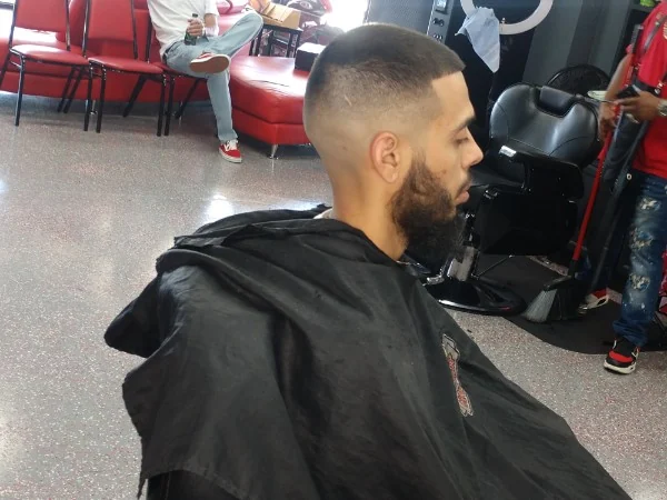 High bald fade with a full beard
