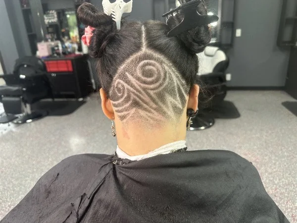 Freehand swirl design shaved into an undercut