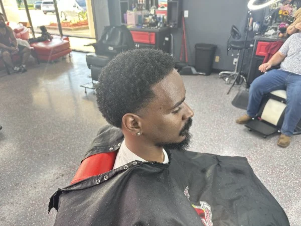 Natural afro top with a full beard